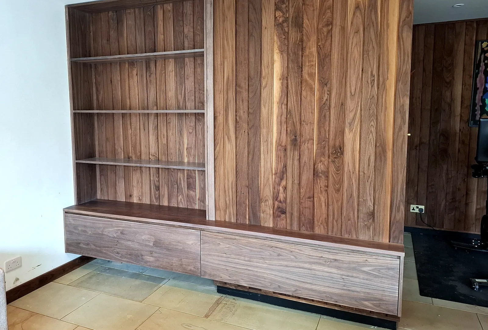 Walnut media wall with open shelving and handleless drawers, built and fitted by HS Joinery