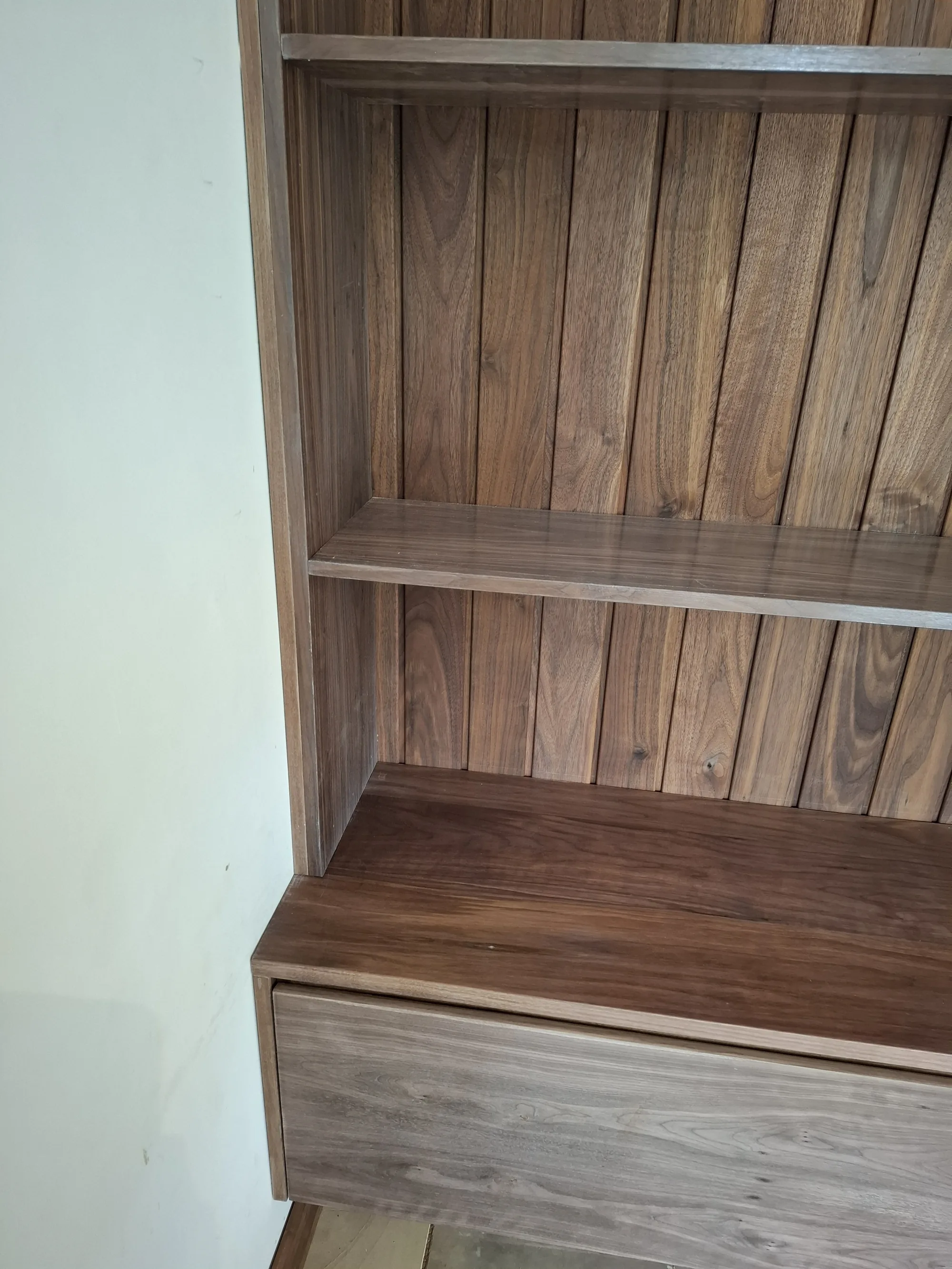 Walnut shelf and floating base detail