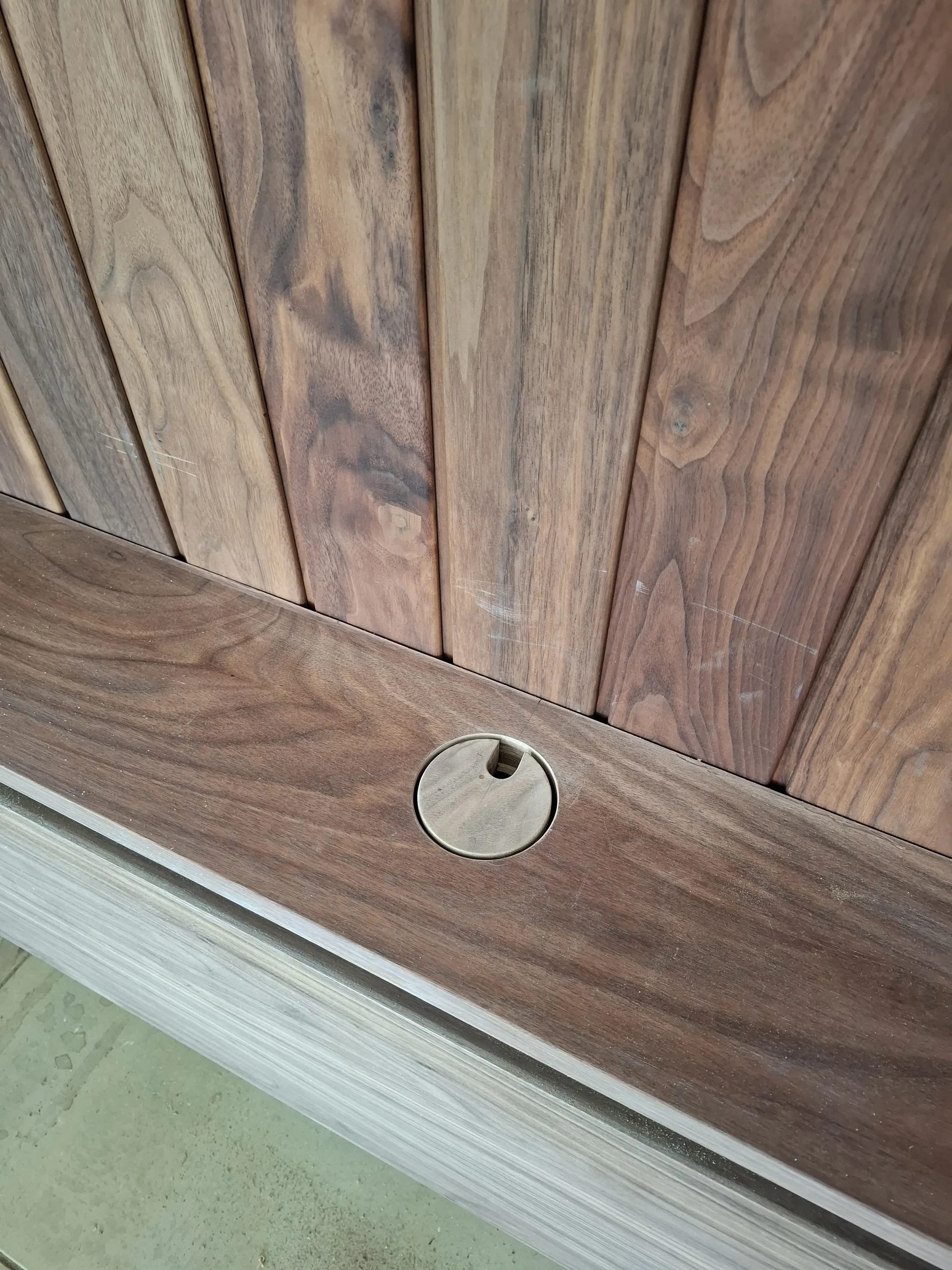 Cable grommet set into the walnut top