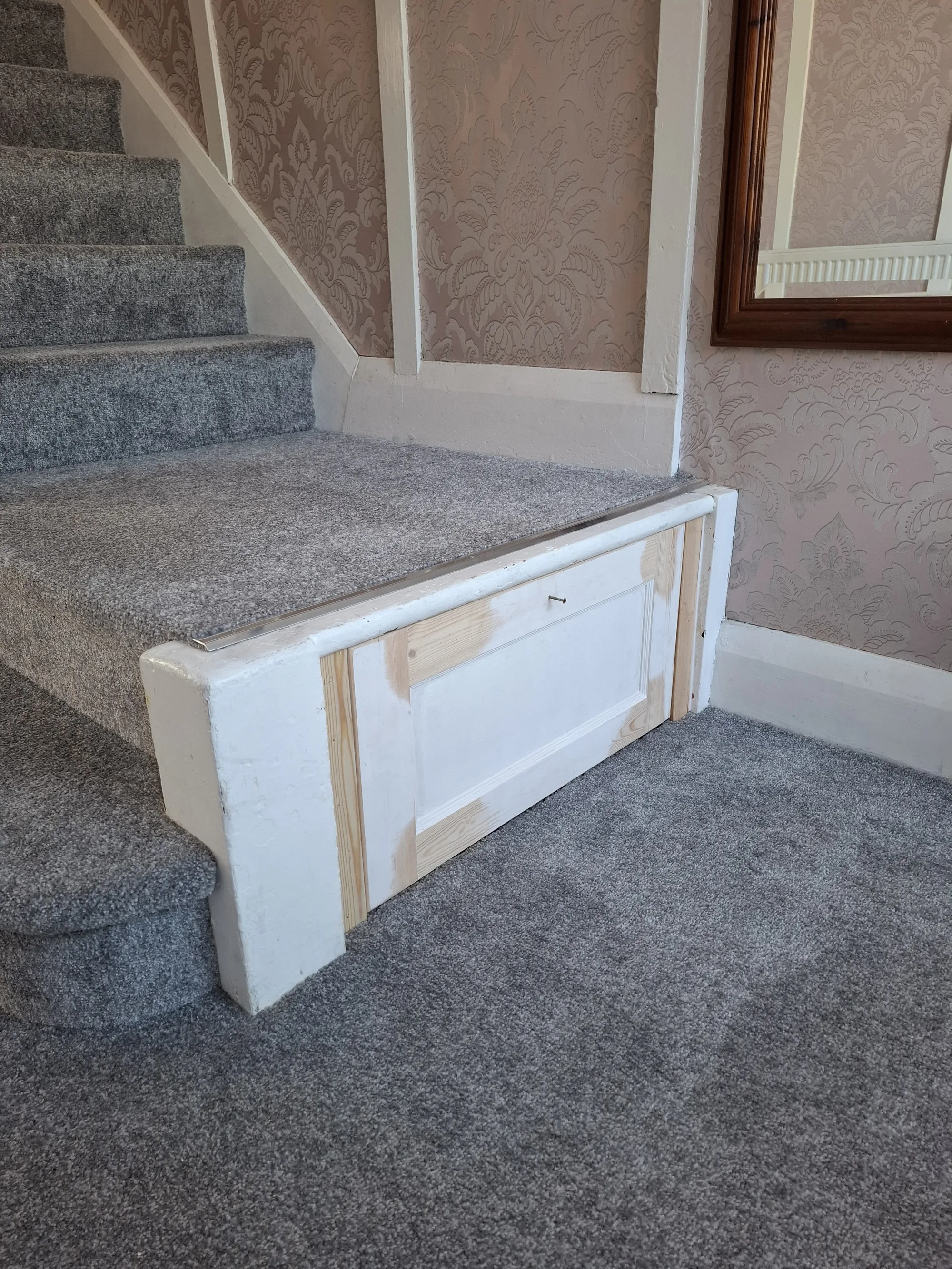 The drawer closed, sitting flush in the step